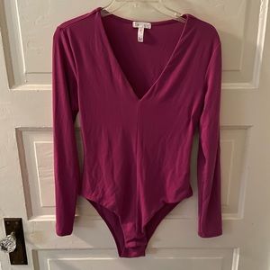 Leigh hot pink long sleeve body suit. Size M.